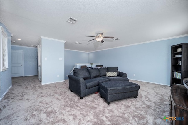 living room featuring carpet, visible vents, ornamental molding, a ceiling fan, and baseboards