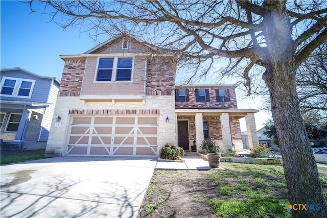 view of front facade with driveway, brick siding, and an attached garage