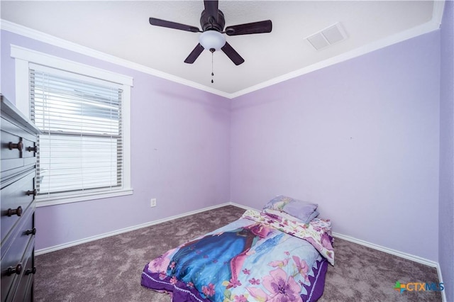 bedroom featuring carpet floors, ornamental molding, visible vents, and baseboards