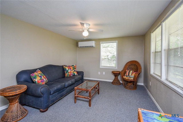 1551 Bayview Dr, Palacios, TX 77465 - living room featuring carpet, baseboards, a wall unit AC, and a ceiling fan