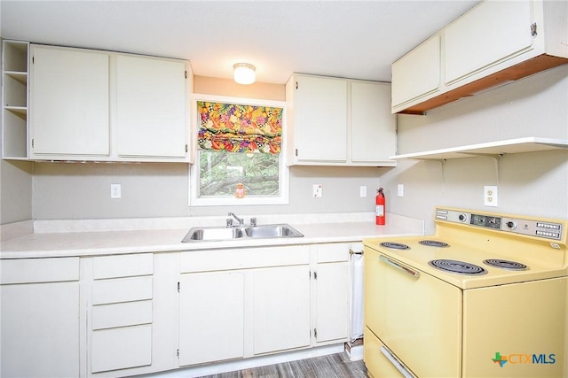 1551 Bayview Dr, Palacios, TX 77465 - kitchen with open shelves, a sink, white range with electric stovetop, and light countertops