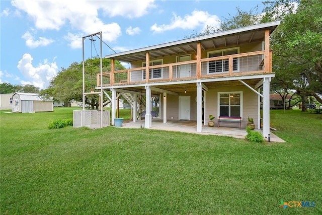 1551 Bayview Dr, Palacios, TX 77465 - rear view of property with a lawn, a patio area, stairs, and a deck