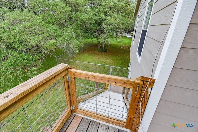 1551 Bayview Dr, Palacios, TX 77465 - deck featuring a lawn and a fenced backyard