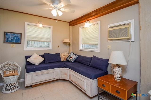 1551 Bayview Dr, Palacios, TX 77465 - living room featuring a ceiling fan, a healthy amount of sunlight, and light tile patterned floors