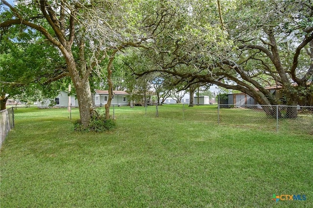 1551 Bayview Dr, Palacios, TX 77465 - view of yard featuring a fenced backyard