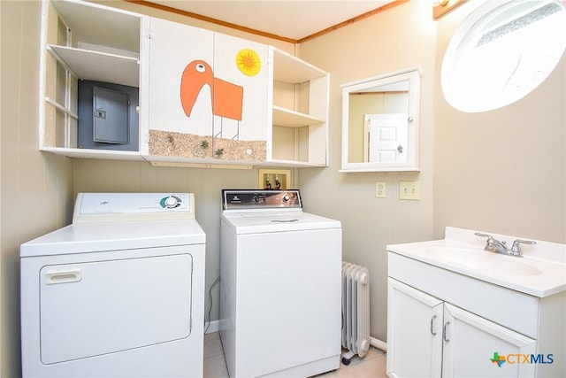 1551 Bayview Dr, Palacios, TX 77465 - clothes washing area with radiator, electric panel, separate washer and dryer, a sink, and cabinet space