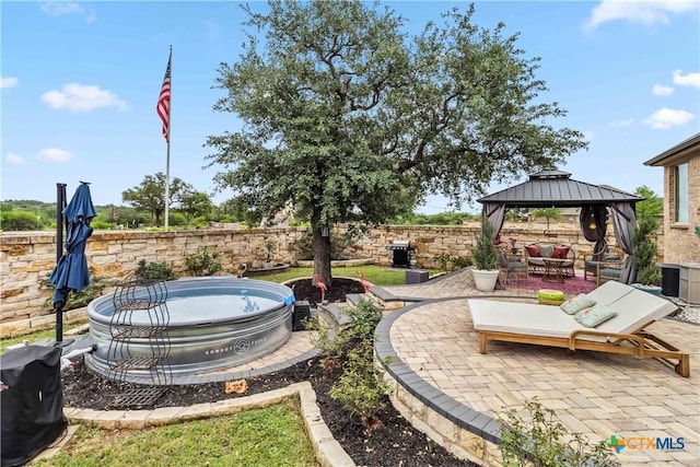 1404 Andalucia Dr, San Marcos, TX 78666 - view of patio / terrace with a gazebo, a fenced backyard, and an outdoor hot tub