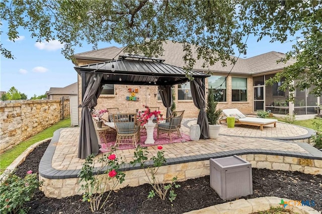 1404 Andalucia Dr, San Marcos, TX 78666 - view of patio with a gazebo, fence, a sunroom, and outdoor dining area
