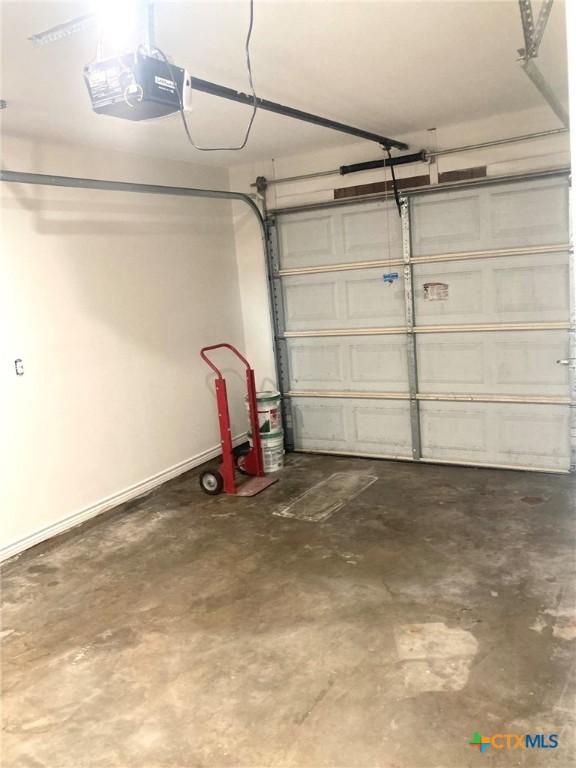 1502 Bowie Dr, Victoria, TX 77901 - garage featuring a garage door opener