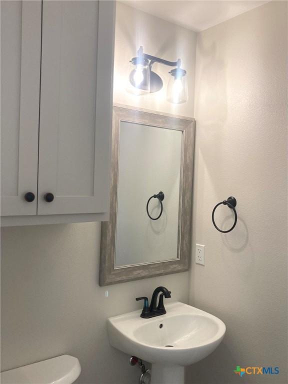 1502 Bowie Dr, Victoria, TX 77901 - bathroom featuring a sink and toilet