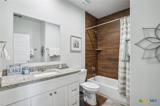 full bathroom with toilet, vanity, shower / bath combo, and hardwood / wood-style floors