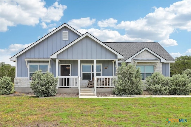 view of front of property with a front yard and a porch