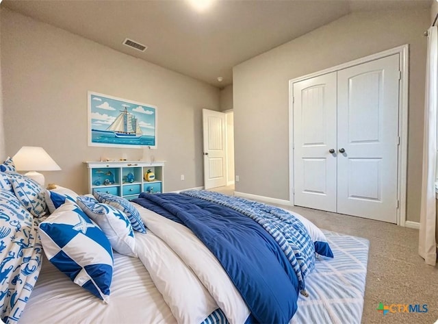 bedroom with carpet, a closet, baseboards, and visible vents