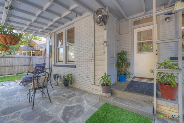 8 Herry Ct, New Braunfels, TX 78130 - doorway to property with brick siding and a patio