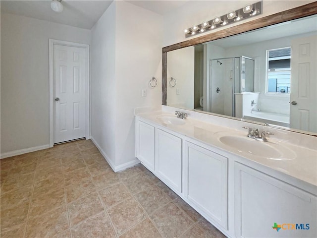 bathroom featuring toilet, a stall shower, a sink, and a bath