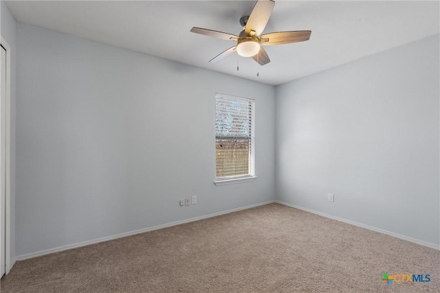 empty room with carpet and ceiling fan