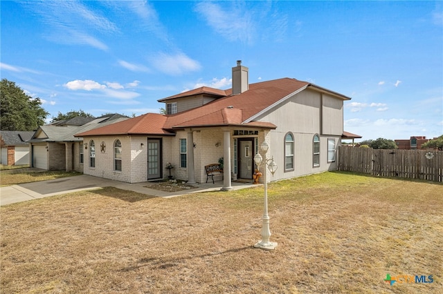 back of house featuring a yard