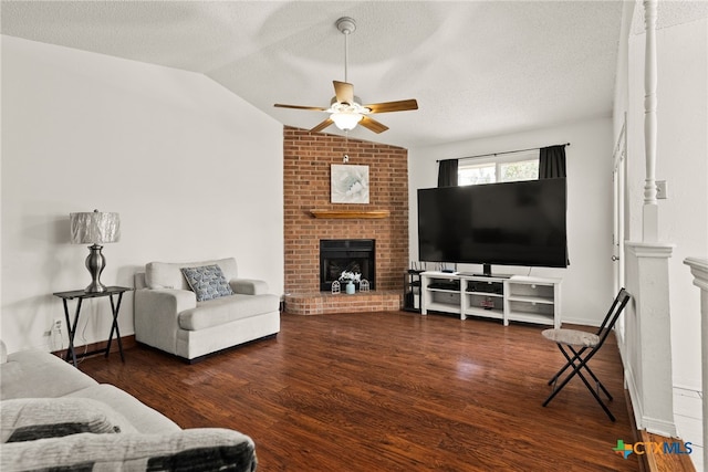 living room with lofted ceiling, ceiling fan, a textured ceiling, and dark hardwood / wood-style flooring