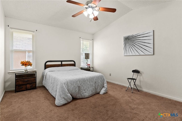 bedroom featuring carpet, lofted ceiling, and ceiling fan