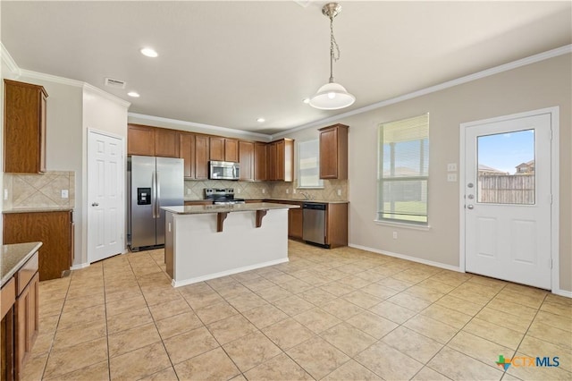 2523 Red Fern Dr, Harker Heights, TX 76548 - kitchen with stainless steel appliances, ornamental molding, decorative backsplash, light tile patterned floors, and a kitchen breakfast bar