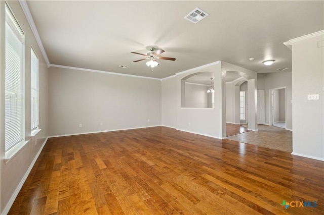 2523 Red Fern Dr, Harker Heights, TX 76548 - empty room featuring ceiling fan, wood finished floors, arched walkways, and ornamental molding