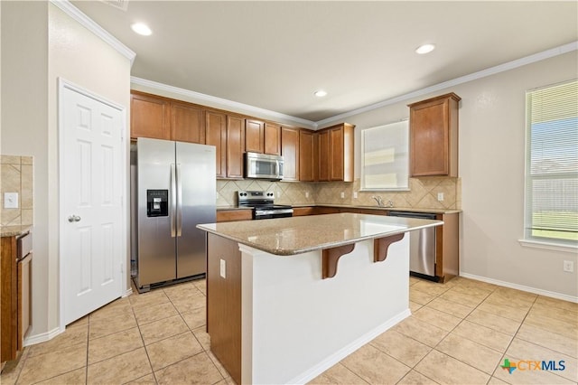 2523 Red Fern Dr, Harker Heights, TX 76548 - kitchen with appliances with stainless steel finishes, light tile patterned floors, tasteful backsplash, ornamental molding, and recessed lighting