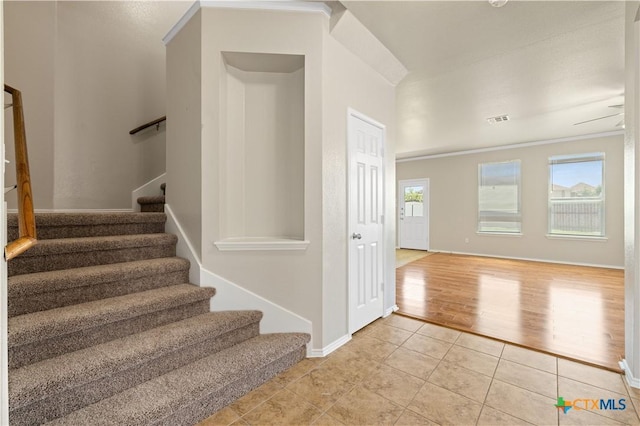 2523 Red Fern Dr, Harker Heights, TX 76548 - staircase with tile patterned flooring and ornamental molding