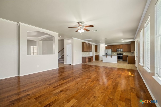 2523 Red Fern Dr, Harker Heights, TX 76548 - unfurnished living room featuring a ceiling fan, wood finished floors, stairs, recessed lighting, and ornamental molding