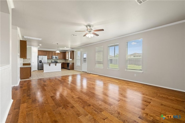 2523 Red Fern Dr, Harker Heights, TX 76548 - unfurnished living room featuring crown molding, a ceiling fan, light wood finished floors, and recessed lighting