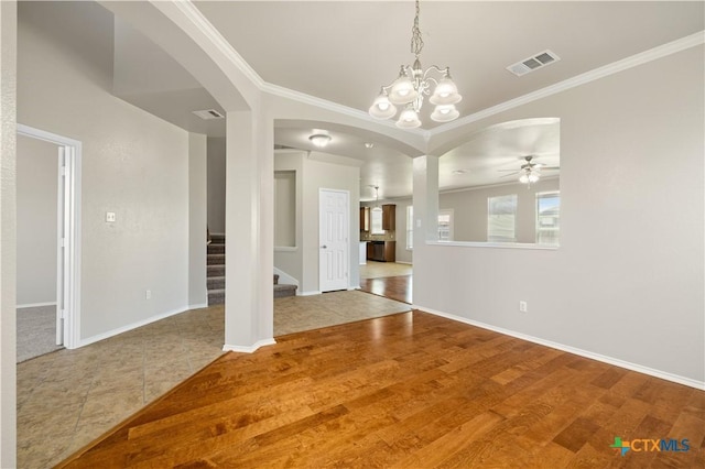 2523 Red Fern Dr, Harker Heights, TX 76548 - unfurnished living room with arched walkways, crown molding, a ceiling fan, stairs, and a chandelier