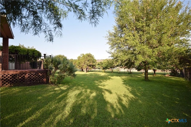 2009 Sandy Point Rd, Harker Heights, TX 76548 - view of green lawn with a wooden deck