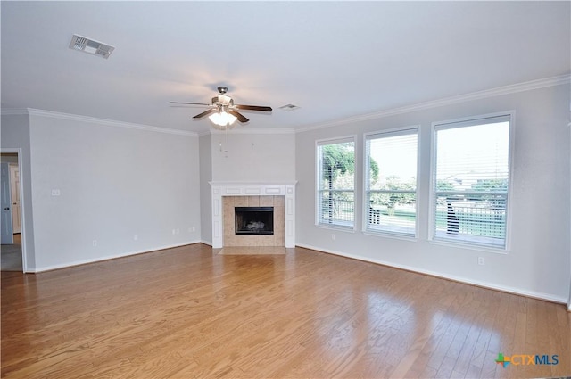 2009 Sandy Point Rd, Harker Heights, TX 76548 - unfurnished living room with a ceiling fan, wood finished floors, ornamental molding, and a fireplace