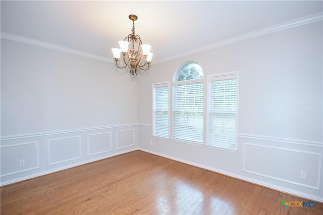 2009 Sandy Point Rd, Harker Heights, TX 76548 - spare room featuring a chandelier, light wood-type flooring, and crown molding