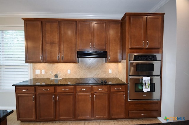 2009 Sandy Point Rd, Harker Heights, TX 76548 - kitchen with double oven, black electric cooktop, under cabinet range hood, dark stone counters, and ornamental molding