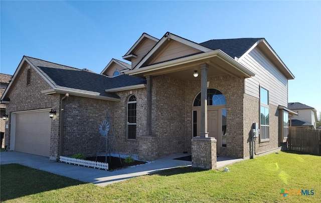 view of front of property with an attached garage, brick siding, fence, roof with shingles, and a front yard