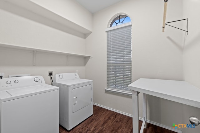 laundry room with laundry area, baseboards, washer and clothes dryer, and dark wood-type flooring