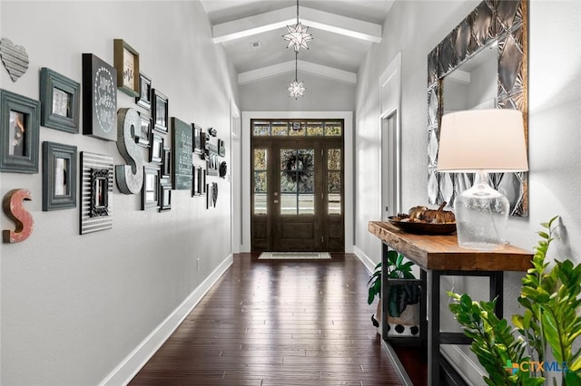 entrance foyer with vaulted ceiling with beams, dark hardwood / wood-style floors, and an inviting chandelier