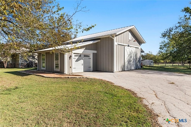 garage with a yard