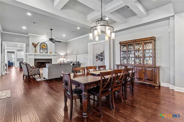 dining area featuring ceiling fan with notable chandelier, dark hardwood / wood-style flooring, beam ceiling, and coffered ceiling