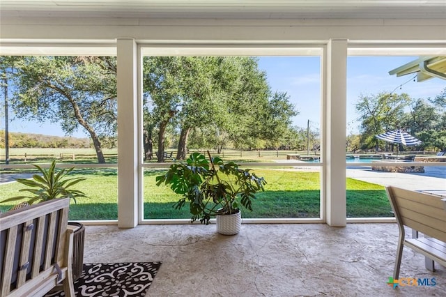 doorway to outside featuring a wealth of natural light