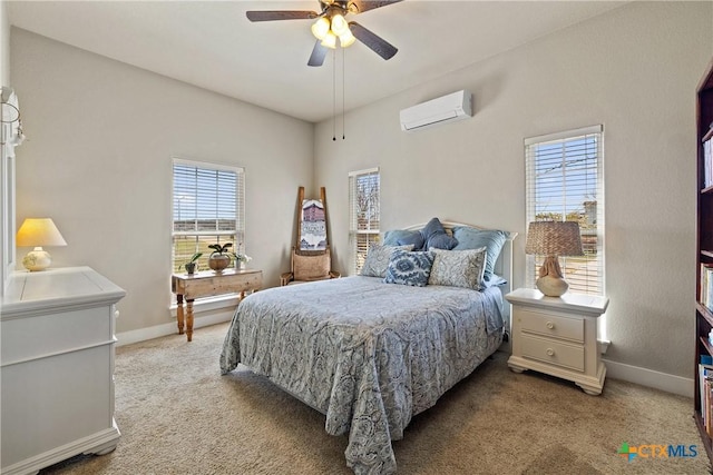 428 Colorado Dr, Cedar Creek, TX 78612 - bedroom featuring a wall mounted AC, light carpet, baseboards, and a ceiling fan