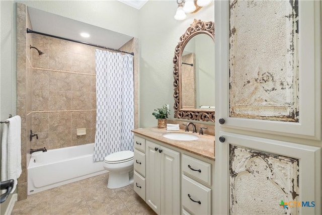 full bathroom featuring toilet, vanity, tile patterned flooring, and shower / tub combo with curtain