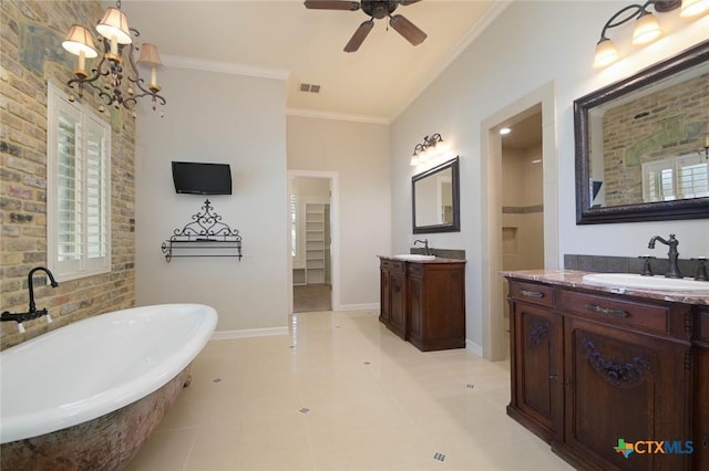 bathroom with tile patterned flooring, vanity, ornamental molding, separate shower and tub, and ceiling fan with notable chandelier