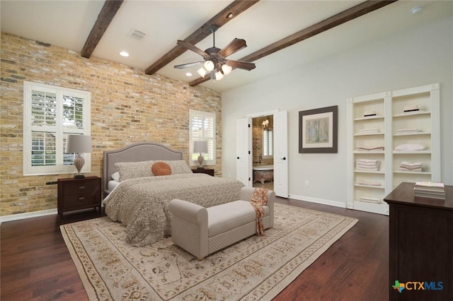 bedroom featuring ensuite bathroom, beamed ceiling, ceiling fan, brick wall, and dark wood-type flooring