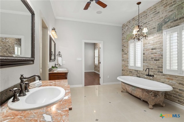 bathroom with brick wall, ornamental molding, a bathtub, and tile patterned floors