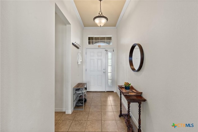 tiled foyer with crown molding