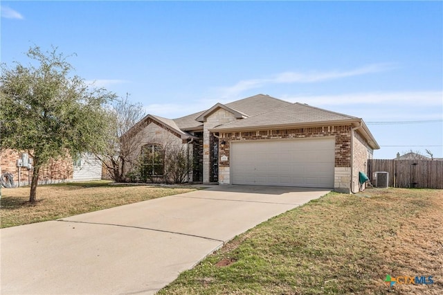 single story home with a garage, a front yard, and cooling unit