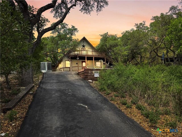 209 Lake Frst, Canyon Lake, TX 78133 - view of front of home with driveway and a porch