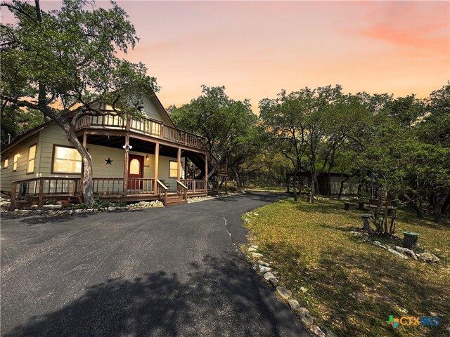 209 Lake Frst, Canyon Lake, TX 78133 - chalet / cabin featuring covered porch
