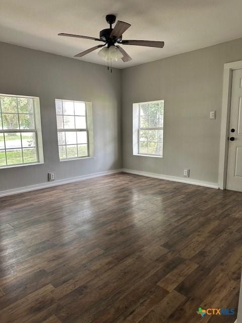 101 S Vine St, Victoria, TX 77901 - unfurnished room featuring plenty of natural light, dark wood finished floors, and ceiling fan